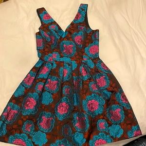 A beautiful floral broach dress for sale